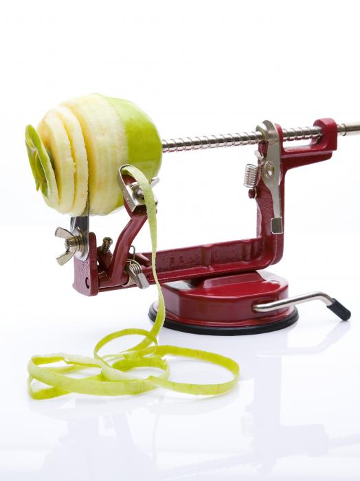 Eplucheur de pommes : pèle, évide et tranche